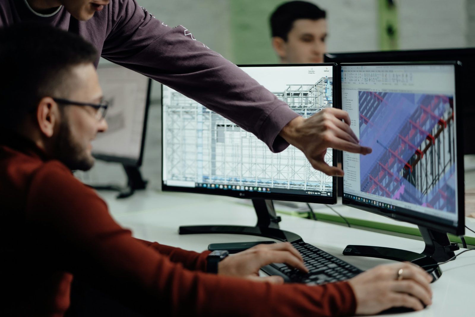 CITA engineers reviewing structural models on screen